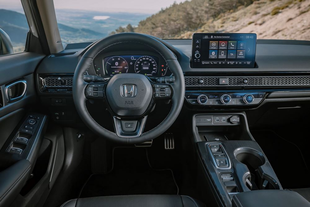 La Honda Civic hybride cinq portes se singularise par une ligne de toit plongeante